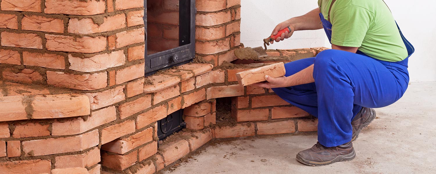 Image of a fireplace being built by hand